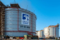 ADNOC transfers stakes in listed units to international arm XRG